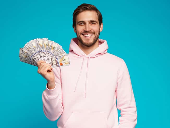 Young man holding money